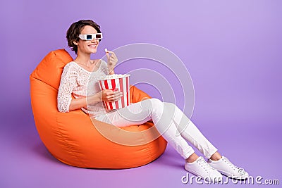 Photo of cute sweet woman wear knitted shirt sitting beanbag popcorn watching comedy movie violet color Stock Photo