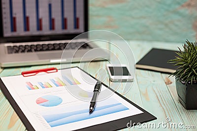 Photo diagrams graphs and numerals in the table on the paper Stock Photo