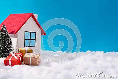 Photo of dream colorful north pole santa claus workshop house in iceland red roof surrounded by big giftboxes evergreen Stock Photo