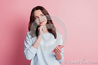Photo of dreamy girl use smartphone finger chin look up empty space Stock Photo