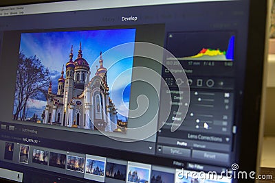 Photo editing on laptop. Photographer`s computer with professional software. Image post processing Stock Photo