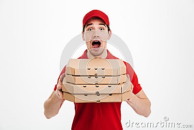 Photo of emotional guy from delivery service in red t-shirt and Stock Photo