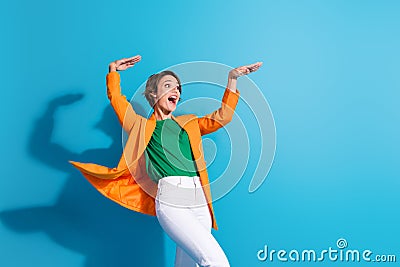 Photo of energetic young businesswoman formal elegant clothes hands up rhythm boogie woogie look mockup isolated on blue Stock Photo