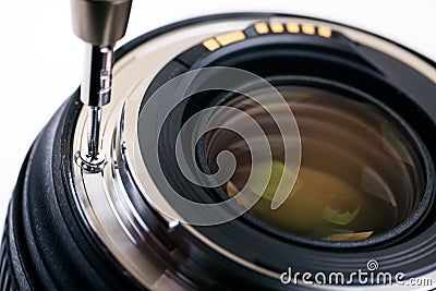 Photo equipment service, disassembling camera lens Stock Photo