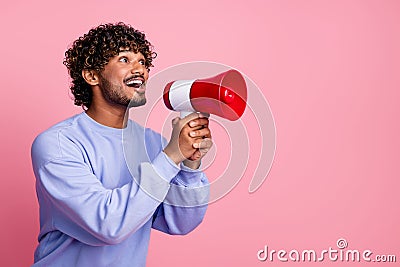 Photo of excited cheerful guy wear trendy clothes hold bullhorn tell say proclaim news isolated on pink color background Stock Photo