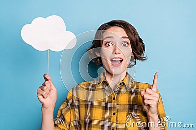 Photo of excited creative lady hold cloud card have great idea wear plaid shirt isolated blue color background Stock Photo