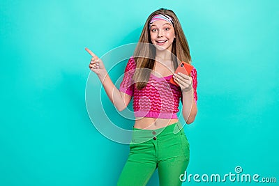 Photo of excited impressed girl blond hair wear pink knit top instagram telegram facebook twitter on turquoise Stock Photo