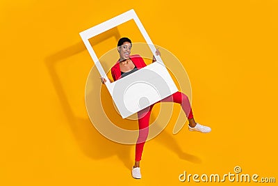 Photo excited short butch hair lady guy hold active snapshot frame wear red stylish trendy blazer shine color Stock Photo