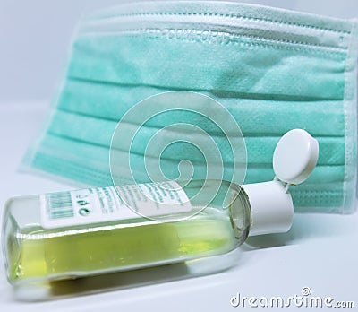 A photo of a face cloth next to an empty hand anti bacterial gel reflecting the medical supplies shortage in the corona crisis Editorial Stock Photo