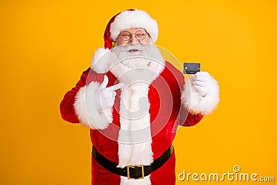 Photo fat white grey hair beard santa claus point finger credit card best choice x-mas eve noel christmas magic party Stock Photo
