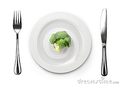 Photo of the fork and knife with white plate and broccoli on white Stock Photo