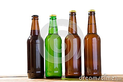 Photo of four different full beer bottles with no labels. Separate clipping path for each bottle included. Four 4 separate photos Stock Photo