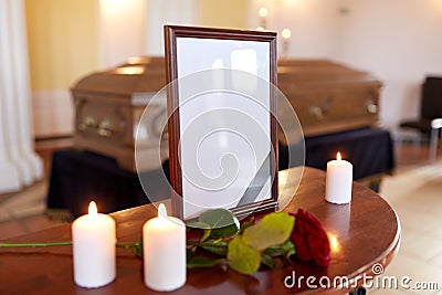 Photo frame and coffin at funeral in church Stock Photo