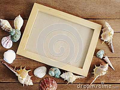 photo frame with marine nautical decoration on wooden background Stock Photo