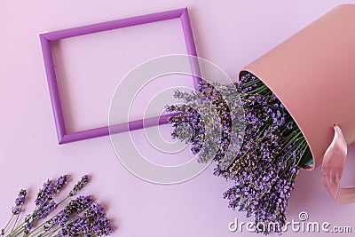 Photo frame on a pastel background with lavender bouquets, space for text, top view Stock Photo
