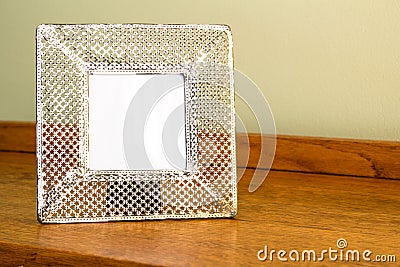 Photo frame - Wide cream coloured metal punched delicate frame w Stock Photo