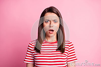 Photo of frightened pretty young brown hair lady wear stripy red white t-shirt isolated on pastel pink color background Stock Photo