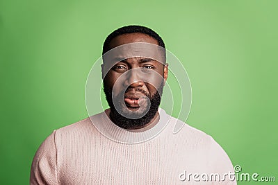 Photo of frustrated desperate man crying face grimace wear white shirt over green background Stock Photo