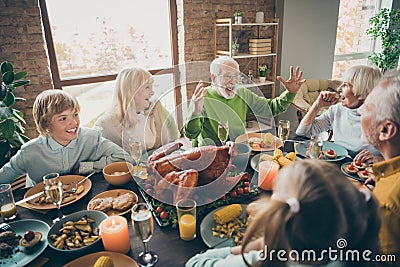 Photo of full family reunion gathering sit feast dishes chicken table communicating fall november autumn holiday multi Stock Photo