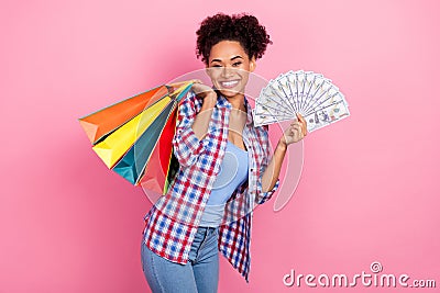 Photo of funky wavy hairdo lady hold bags money wear plaid shirt jeans isolated on pink color background Stock Photo