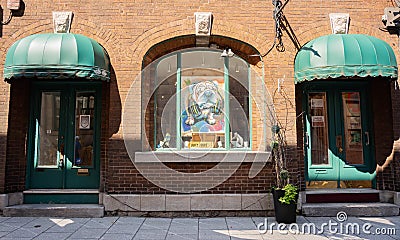 Photo of funny dog in the window of the store in old city of Quebec Editorial Stock Photo