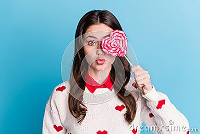 Photo of funny flirty young lady wear hearts print sweater cover eye candy lips pouted isolated blue color background Stock Photo