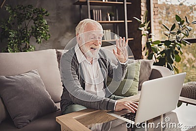 Photo of funny pensioner wear grey cardigan sitting looking modern gadget have video call indoors house flat Stock Photo