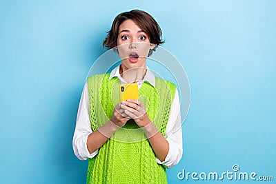 Photo of funny surprised open mouth staring librarian woman shocked confused hold smartphone dislike notification Stock Photo