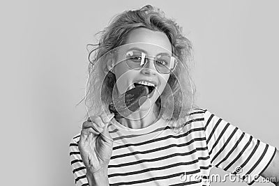 photo of girl eat icelolly ice cream at summer. girl with icelolly ice cream isolated on yellow. Stock Photo