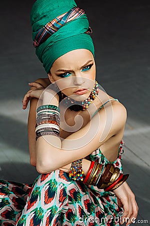 Photo of girl with large accessories in African style Stock Photo