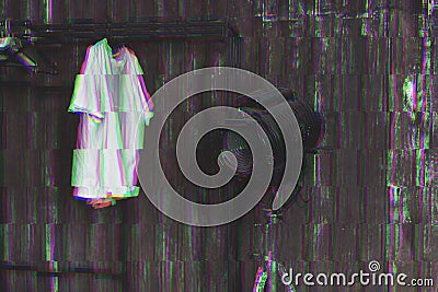 Photo with glitch effect. Design of loft Interior of dressing room. Metal wall and cinema lightning and white t-shirt on Stock Photo