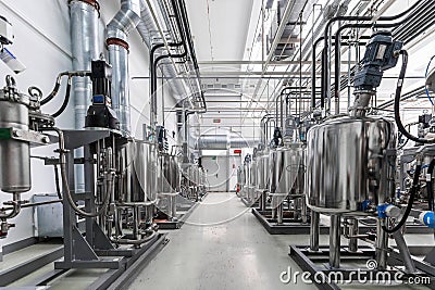 Photo of gray pipes and tanks. Chemistry and medicine production. Pharmaceutical factory. Interior of a high-tech Stock Photo