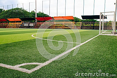 Photo of a green synthetic grass sports field with white line sh Stock Photo