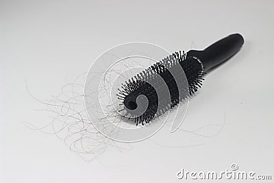 Photo Hair fall at white Black plastick comb, White Background Stock Photo