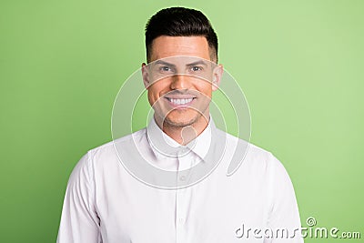 Photo of handsome cheerful brunet businessman toothy beaming smile wear white shirt isolated green color background Stock Photo
