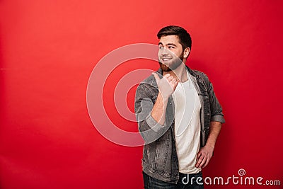 Photo of handsome man 30s in casual clothing gesturing fingers b Stock Photo