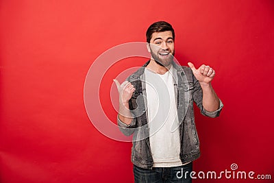 Photo of handsome man 30s in casual clothing gesturing fingers a Stock Photo