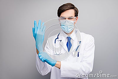 Photo of handsome serious doc guy professional surgeon specialist preparing operation wear gloves facial protective mask Stock Photo