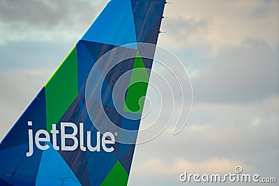 Photo of a jetblue airplane tail with company logo Editorial Stock Photo