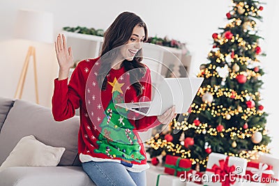 Photo of joyful positive lady comfort cozy houseroom indoors speaking relatives friends remote meeting say hello Stock Photo