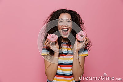 Photo of joyous woman 20s with curly hair having fun and holding Stock Photo