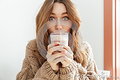 Photo of joyous young woman 20s looking on camera with exciting Stock Photo