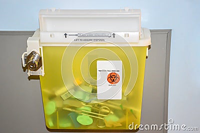 Photo of a locked yellow sharps container Stock Photo