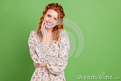 Photo of lovely curly hairdo young lady hand face wear blouse isolated on pastel green color background Stock Photo