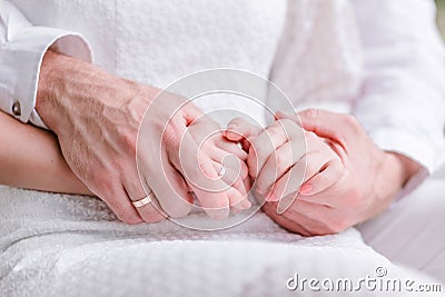 A man gently embraces a woman`s hands Stock Photo