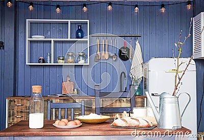 Milk, eggs, bread, flour on a table in a rustic kitchen Stock Photo