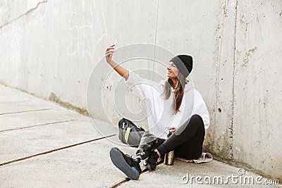 Photo of modern young handicapped woman in streetwear having bio Stock Photo