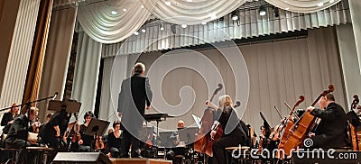 Photo musicians. Musical concert in the Philharmonic. Violin player. Music concert background Editorial Stock Photo