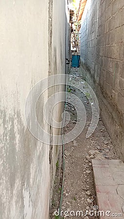 photo of a narrow residential alleyway Stock Photo