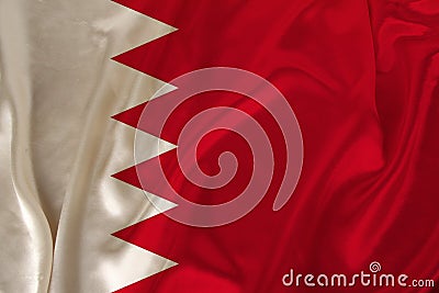 Photo of the national flag of Bahrain state on a luxurious texture of satin, silk with waves, folds and highlights, close-up, copy Cartoon Illustration
